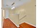 Open hallway features wood floors, modern lighting, and staircase to the main level at 1534 Barking Deer Cv, Casselberry, FL 32707