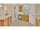 Kitchen area with stainless steel appliances and backyard access at 1534 Barking Deer Cv, Casselberry, FL 32707