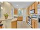 Well-appointed kitchen with stainless steel appliances and access to the backyard at 1534 Barking Deer Cv, Casselberry, FL 32707