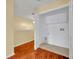 Well-lit laundry room with tile floor and white cabinets for storage above appliances at 1534 Barking Deer Cv, Casselberry, FL 32707