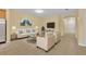 Staged living room that features neutral paint and flooring with a beige sofa and accent chairs at 1534 Barking Deer Cv, Casselberry, FL 32707