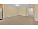 Empty living room featuring neutral walls and flooring with bright overhead lighting at 1534 Barking Deer Cv, Casselberry, FL 32707