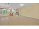 Spacious living area featuring tile floors that lead to the breakfast bar and kitchen at 1534 Barking Deer Cv, Casselberry, FL 32707