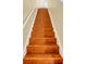 Classic wood staircase with white trim, showcasing the home's traditional design and inviting transition between floors at 1534 Barking Deer Cv, Casselberry, FL 32707