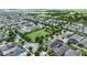 Aerial view of a suburban neighborhood with a park and mature trees at 15448 Murcott Blossom Blvd, Winter Garden, FL 34787