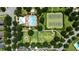 Aerial view of community amenities including pool, playground, and tennis courts at 15448 Murcott Blossom Blvd, Winter Garden, FL 34787