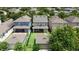 Backyard aerial view of the home featuring manicured lawn and patio at 15448 Murcott Blossom Blvd, Winter Garden, FL 34787