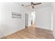 Image of a bedroom with a ceiling fan and hardwood flooring at 15448 Murcott Blossom Blvd, Winter Garden, FL 34787