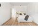 Bright bedroom with neutral-toned walls, light wood floors, and a stylishly decorated bed at 15448 Murcott Blossom Blvd, Winter Garden, FL 34787