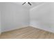 Image of an empty bedroom with a ceiling fan and light wood flooring at 15448 Murcott Blossom Blvd, Winter Garden, FL 34787