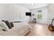 Comfortable bedroom with natural light, modern decor, and a cozy, inviting atmosphere at 15448 Murcott Blossom Blvd, Winter Garden, FL 34787