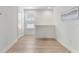 Image of a hallway with hardwood flooring and lots of light at 15448 Murcott Blossom Blvd, Winter Garden, FL 34787