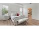 Bright bedroom features lots of light and wood-look floors at 15448 Murcott Blossom Blvd, Winter Garden, FL 34787
