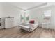 Bright bedroom features lots of light with tray ceiling, and wood-look floors at 15448 Murcott Blossom Blvd, Winter Garden, FL 34787