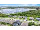 Picturesque aerial shot featuring houses with lake views in a serene neighborhood at 16412 Good Hearth Blvd, Clermont, FL 34711