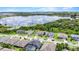 Aerial view of homes and a lake, with a red pin highlighting the property's location at 16412 Good Hearth Blvd, Clermont, FL 34711