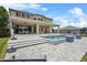 Expansive backyard with a covered patio, swimming pool, and well-maintained landscaping at 16412 Good Hearth Blvd, Clermont, FL 34711