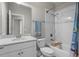 Well-lit bathroom featuring a modern vanity and a clean, tiled shower/tub combination at 16412 Good Hearth Blvd, Clermont, FL 34711
