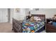 Comfortable bedroom featuring a cozy bed with toys, carpet, and bright natural light at 16412 Good Hearth Blvd, Clermont, FL 34711