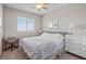 Bright bedroom with a bed, desk and dresser complemented by carpet flooring and natural light at 16412 Good Hearth Blvd, Clermont, FL 34711
