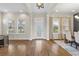 Open-concept foyer with hardwood floors and views of living and dining spaces at 16412 Good Hearth Blvd, Clermont, FL 34711
