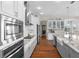 This stunning kitchen features stainless steel appliances and expansive granite countertops at 16412 Good Hearth Blvd, Clermont, FL 34711