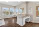 Bright office nook with granite countertops, white cabinetry, and hardwood floors at 16412 Good Hearth Blvd, Clermont, FL 34711