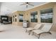 Relaxing outdoor patio featuring lounge chairs and a grill, perfect for entertaining at 16412 Good Hearth Blvd, Clermont, FL 34711