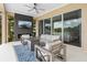 Cozy outdoor patio with a fireplace, tv and comfortable seating, perfect for relaxing at 16412 Good Hearth Blvd, Clermont, FL 34711