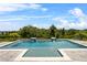 Inviting backyard pool featuring dual water features, mature trees and pristine landscaping at 16412 Good Hearth Blvd, Clermont, FL 34711