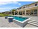 Beautiful swimming pool with a spacious patio area and covered seating at 16412 Good Hearth Blvd, Clermont, FL 34711