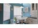 Breakfast nook with table and chairs in front of the window and a hutch to the right at 165 Durham Pl # 165, Longwood, FL 32779