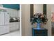 Bright kitchen featuring white cabinets, black countertops and appliances at 165 Durham Pl # 165, Longwood, FL 32779