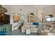 Bright living room featuring a large sectional sofa, built-in display cabinet and decor at 165 Durham Pl # 165, Longwood, FL 32779