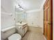 Bathroom featuring a toilet, a sink with a vanity, a bathtub, and a neutral-toned tile floor at 1850 Lakeshore Cir, Longwood, FL 32750