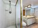 Bathroom with shower, double sinks and vanity, tiled floor, tub and window at 1850 Lakeshore Cir, Longwood, FL 32750