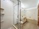 Well-lit bathroom featuring a glass-enclosed shower, toilet, vanity, and a bathtub with a shower at 1850 Lakeshore Cir, Longwood, FL 32750