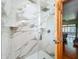 Bathroom featuring a modern glass-enclosed shower with marble-look tile and a view into the home at 1850 Lakeshore Cir, Longwood, FL 32750
