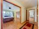 Bedroom with hardwood floors, ceiling fan, and ensuite bathroom and extra room at 1850 Lakeshore Cir, Longwood, FL 32750