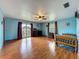 Spacious bedroom with wood floors, a ceiling fan, and sliding glass door to balcony at 1850 Lakeshore Cir, Longwood, FL 32750