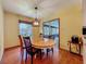 Breakfast nook with wood floors, a modern chandelier, and a view of the outdoors at 1850 Lakeshore Cir, Longwood, FL 32750