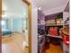 Organized walk-in closet with shelves, wood floors, and bedroom access at 1850 Lakeshore Cir, Longwood, FL 32750