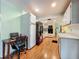 Modern kitchen with white cabinets, stainless steel appliances, and hardwood flooring for a sleek and functional design at 1850 Lakeshore Cir, Longwood, FL 32750