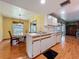 Open kitchen featuring a double sink, white cabinets, and views of the breakfast nook at 1850 Lakeshore Cir, Longwood, FL 32750