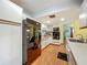 Functional kitchen boasting white cabinets, black appliances, and wood-look floors with ample counter space at 1850 Lakeshore Cir, Longwood, FL 32750