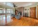 Inviting living room features a brick fireplace, wood floors, and comfortable seating at 1850 Lakeshore Cir, Longwood, FL 32750