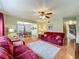 Living room with wood floors, a ceiling fan, and an open floor plan, creating a comfortable and inviting space at 1850 Lakeshore Cir, Longwood, FL 32750