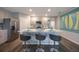 Stylish kitchen featuring stainless steel appliances, a large island with seating, and ample counter space at 1902 Walnut Creek Dr, Kissimmee, FL 34744