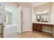 Bathroom featuring dual sinks and a vanity with modern fixtures at 207 Spalding Way, Deland, FL 32724