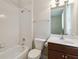 A full bathroom features a shower-tub combo, toilet, and vanity with storage at 207 Spalding Way, Deland, FL 32724